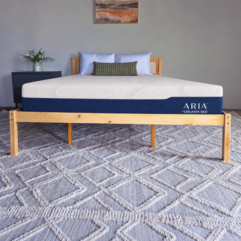 Aria mattress by Organix Bed on a wooden platform bed in a bedroom